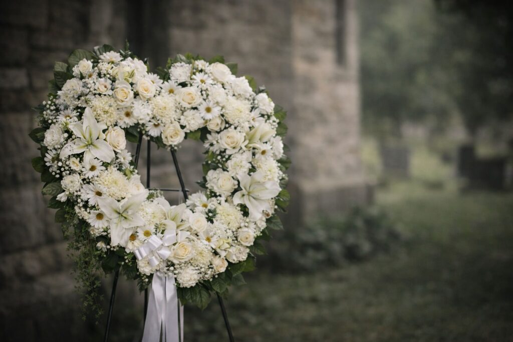 fuenral Flowers Malta wreath stone background