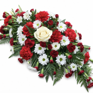 arden funeral spray with seasonal flowers and fern Malta